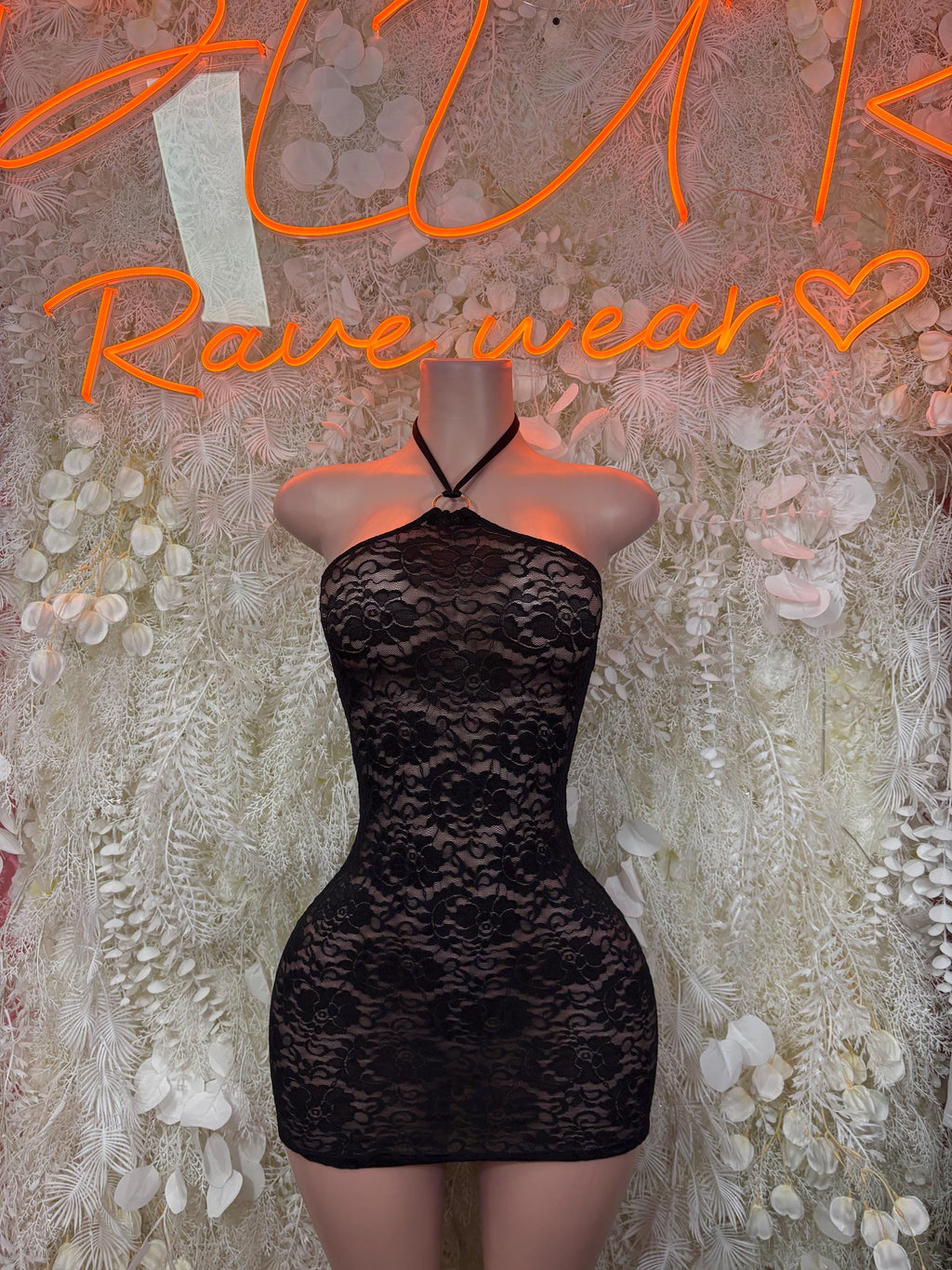 Black lace halter mini dress with scalloped neckline and fitted bodycon silhouette
