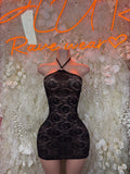 Black lace halter mini dress with scalloped neckline and fitted bodycon silhouette