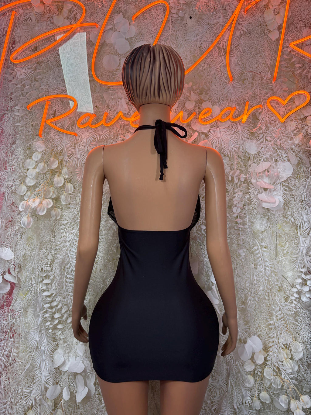 Black halter mini dress with open back and tied strap detail