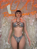 Snake-print two-piece dancewear set with crisscross halter bra and matching bottoms