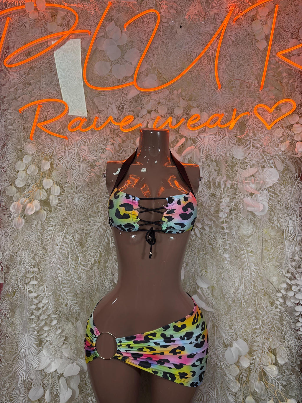 Rainbow leopard print two-piece rave outfit: tie-front halter top and mini skirt