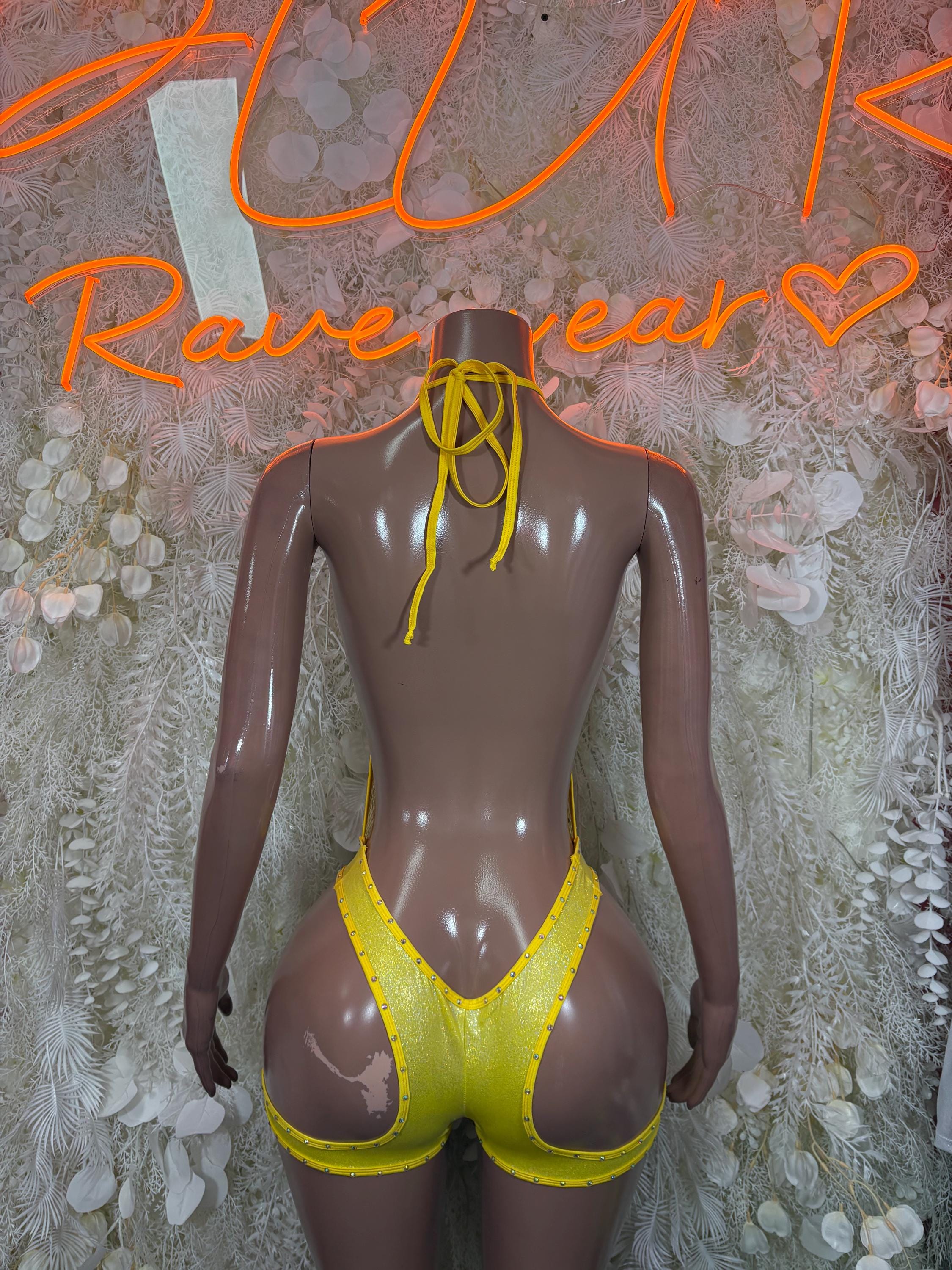 Yellow fishnet bodysuit back view with lace-up ties and cutout sides