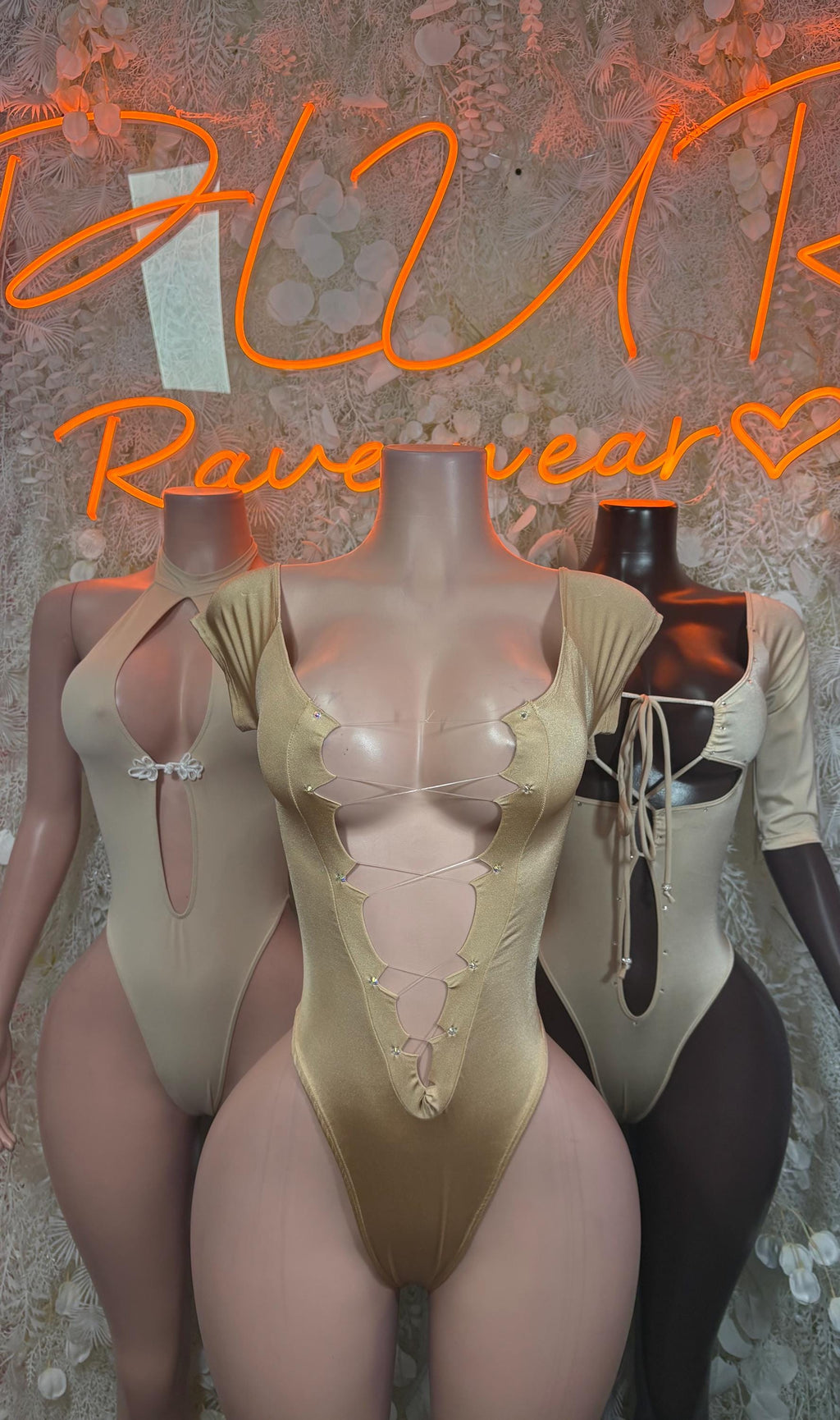 Tan lace-up bodysuit with low neckline and ruched cups