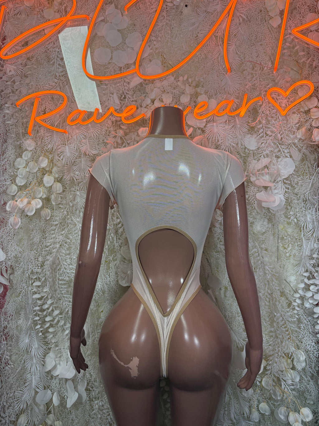 Nude one-piece bodysuit back view with teardrop open panel