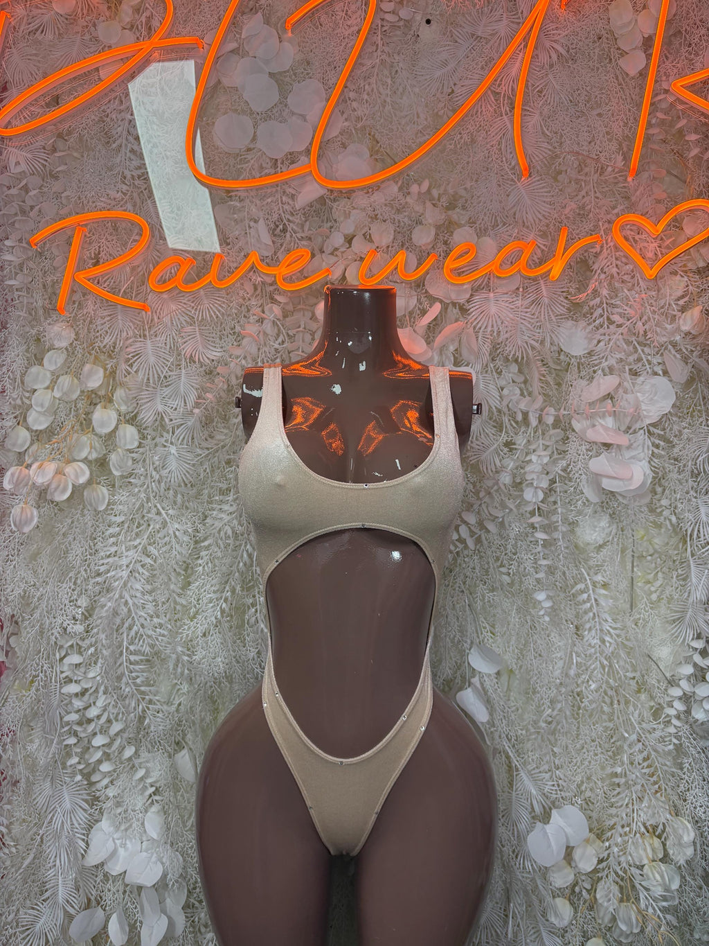 Tan dancewear bodysuit, high-cut one-piece with plunging neckline and backless style