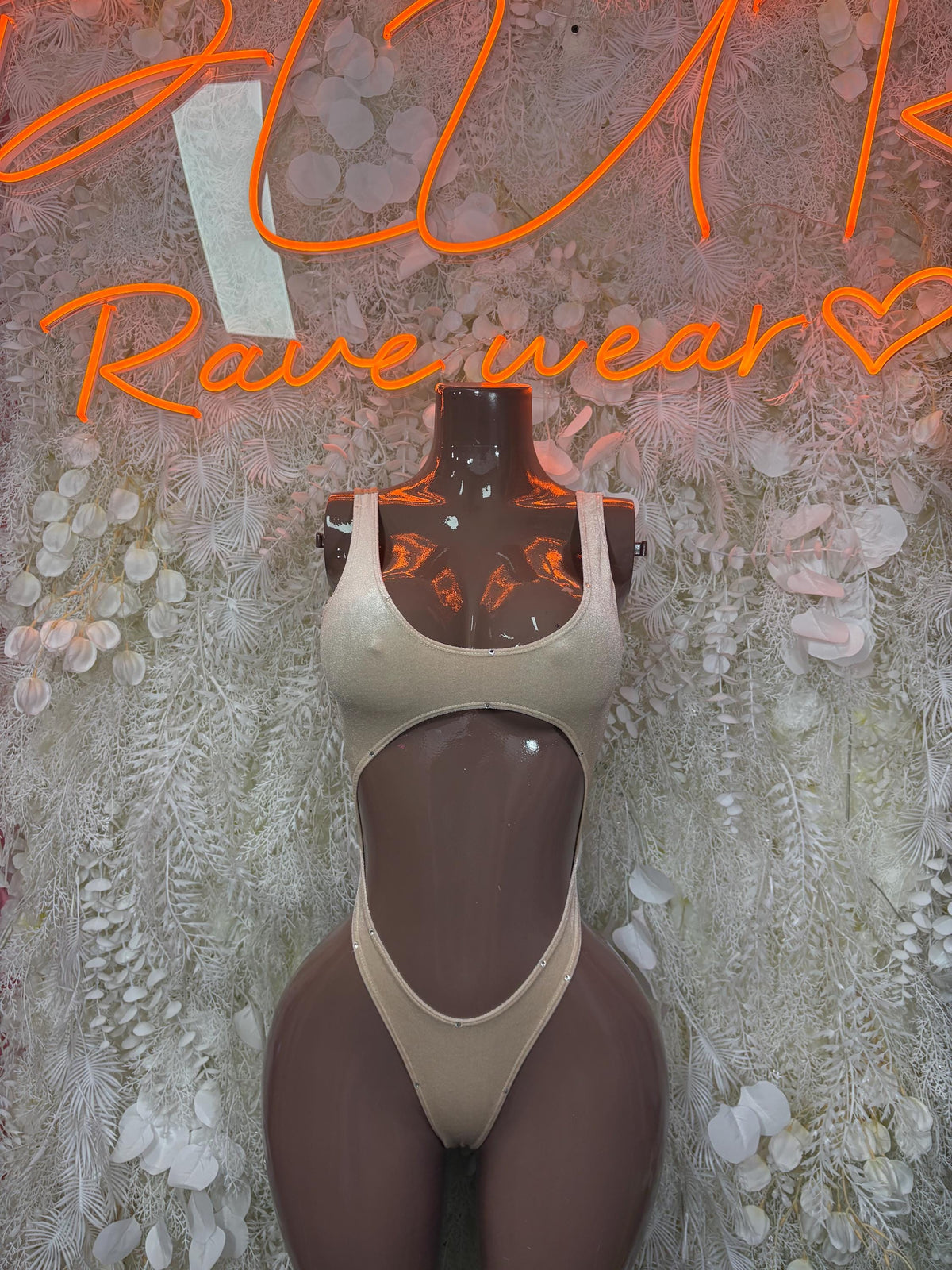 Tan dancewear bodysuit, high-cut one-piece with plunging neckline and backless style