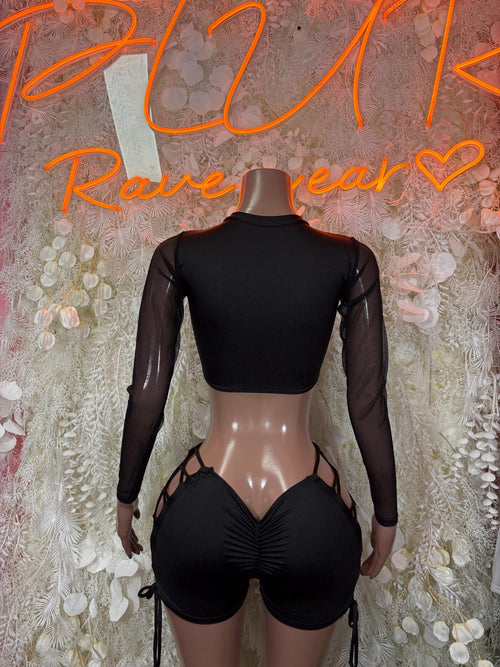 Black long-sleeve bodysuit with lace-up back panel and high-cut shorts