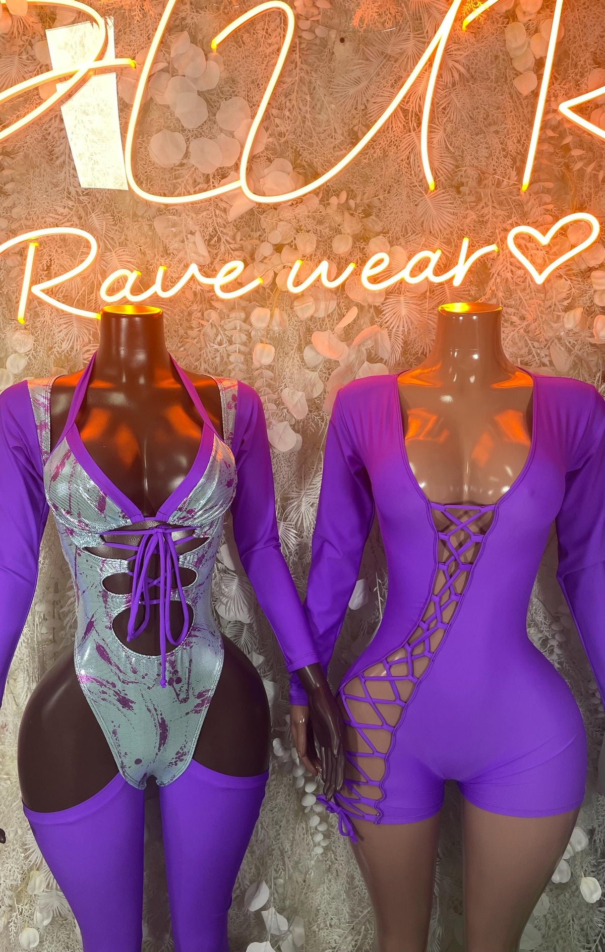 Purple long-sleeve lace-up one-piece bodysuit with open back and crisscross cutouts