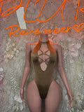 Tan halter bodysuit with crisscross straps and deep V front, high-cut one-piece