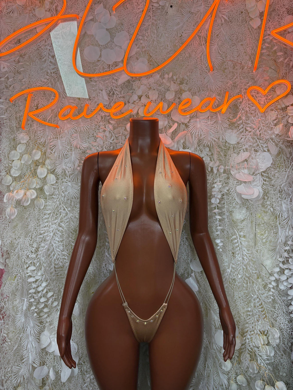Tan halter sequin bodysuit with V-neck and cheeky cut, front view