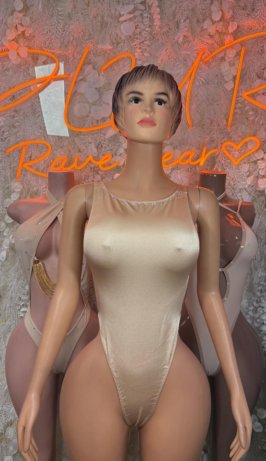 Tan satin bodysuit with square neckline and thin straps, high-cut one-piece
