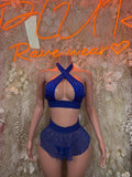 Blue rhinestone halter crop top with crisscross straps and blue mini skirt set