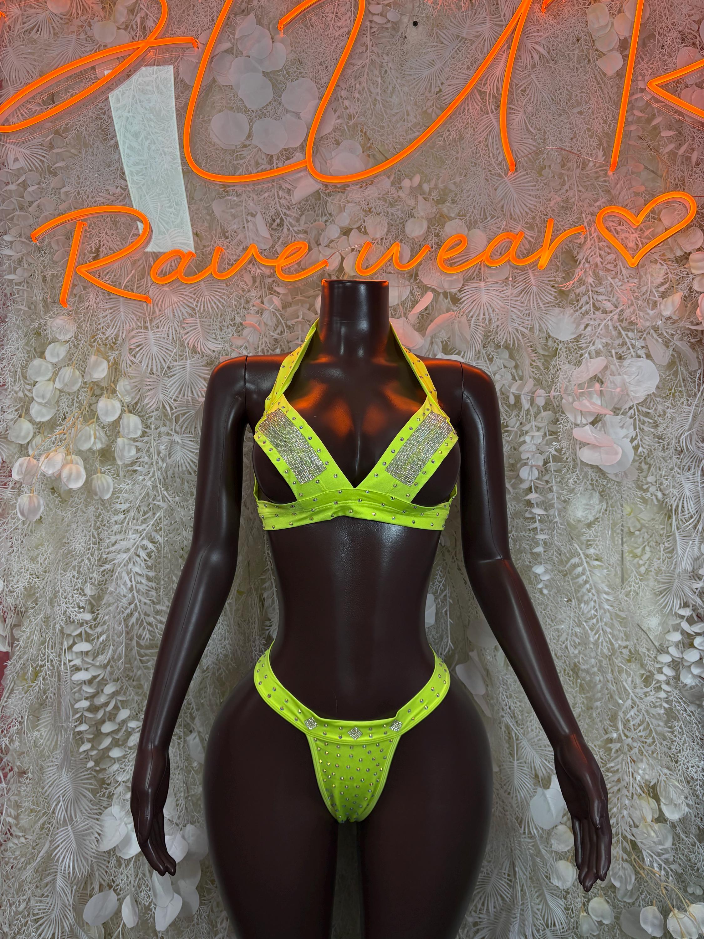 Neon green rhinestone bikini set on black mannequin, triangle bra and thong bottoms