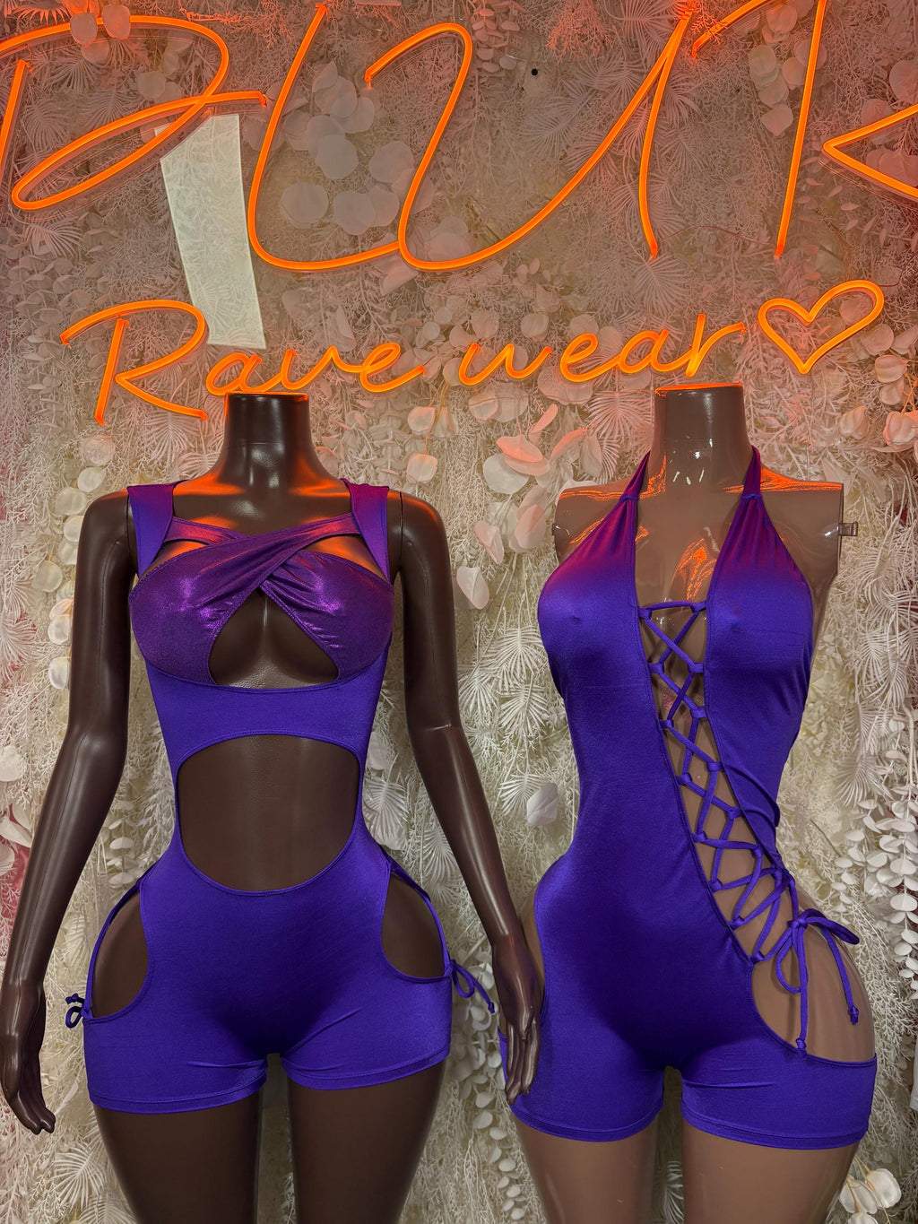 Purple one-piece dance bodysuit with twisted chest and crisscross lace sides