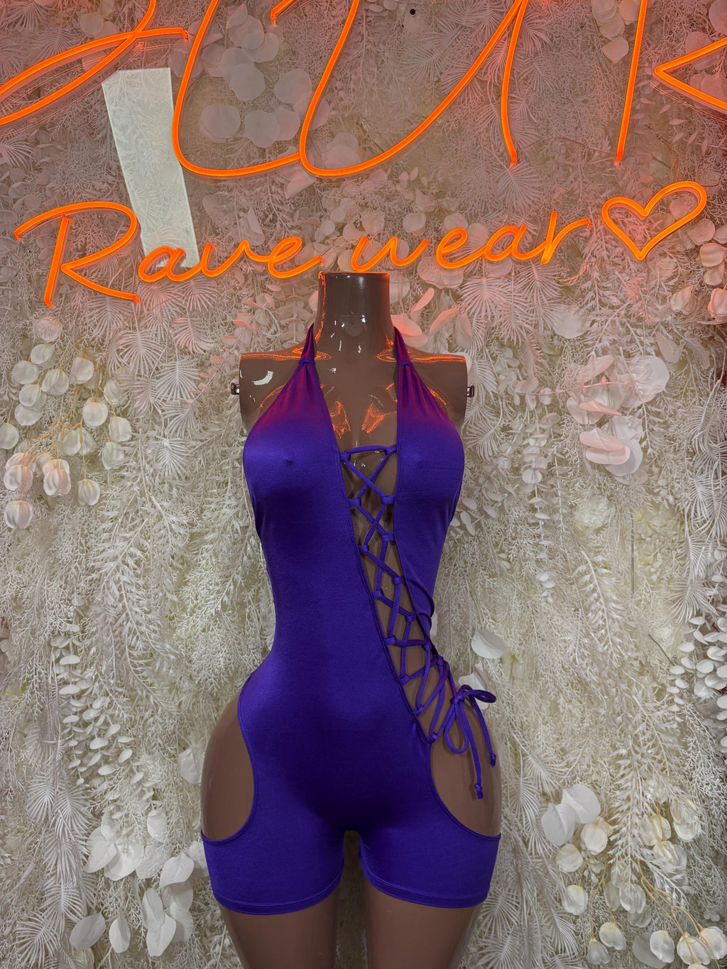 Purple lace-up dancewear playsuit with halter neckline and crisscross front detail
