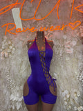 Purple lace-up dancewear playsuit with halter neckline and crisscross front detail