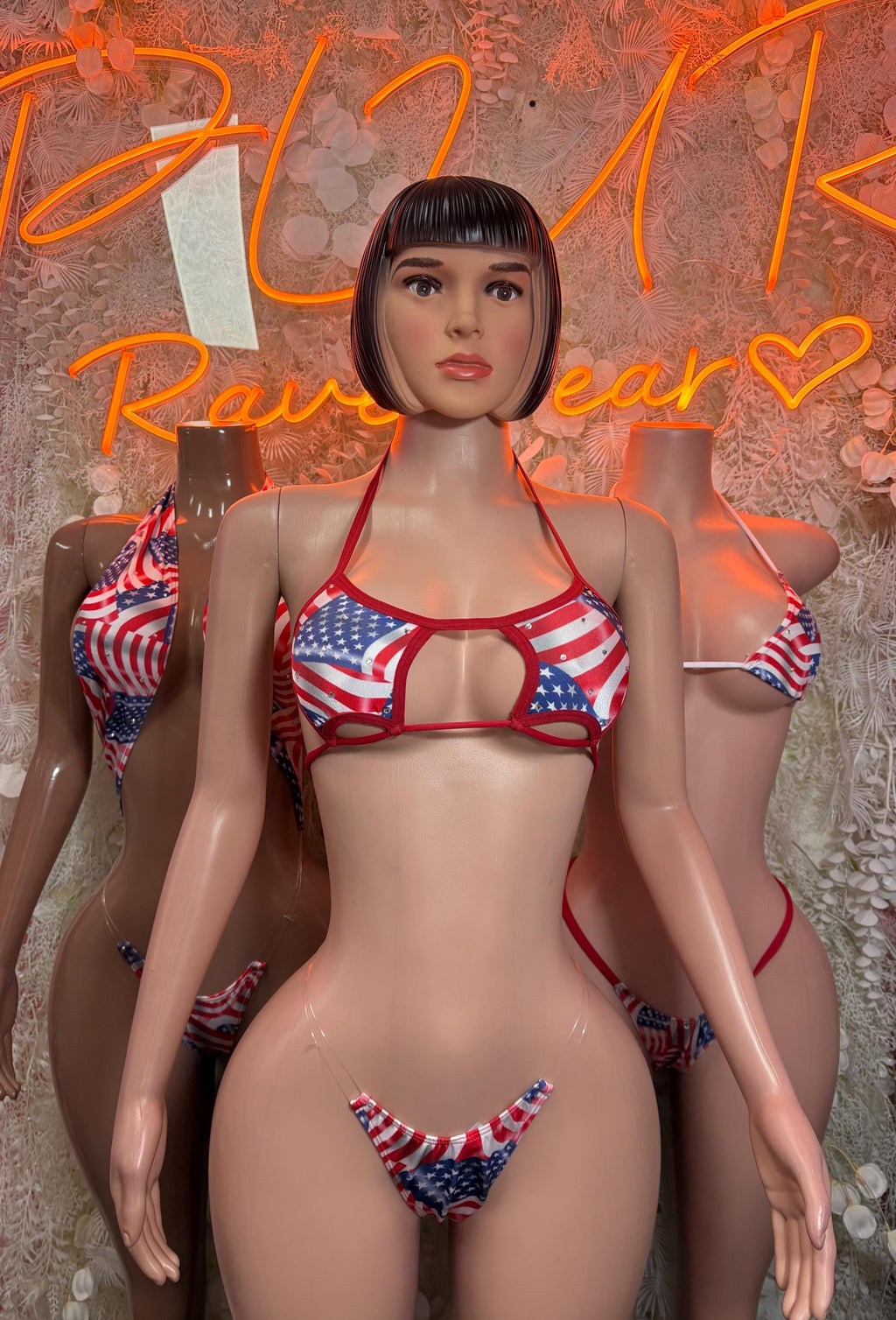 Women's front-view bikini swimsuit with stars-and-stripes print, red/white/blue triangle top