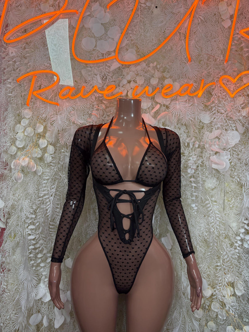 Black heart-pattern mesh bodysuit with long sleeves and lace-up front neckline