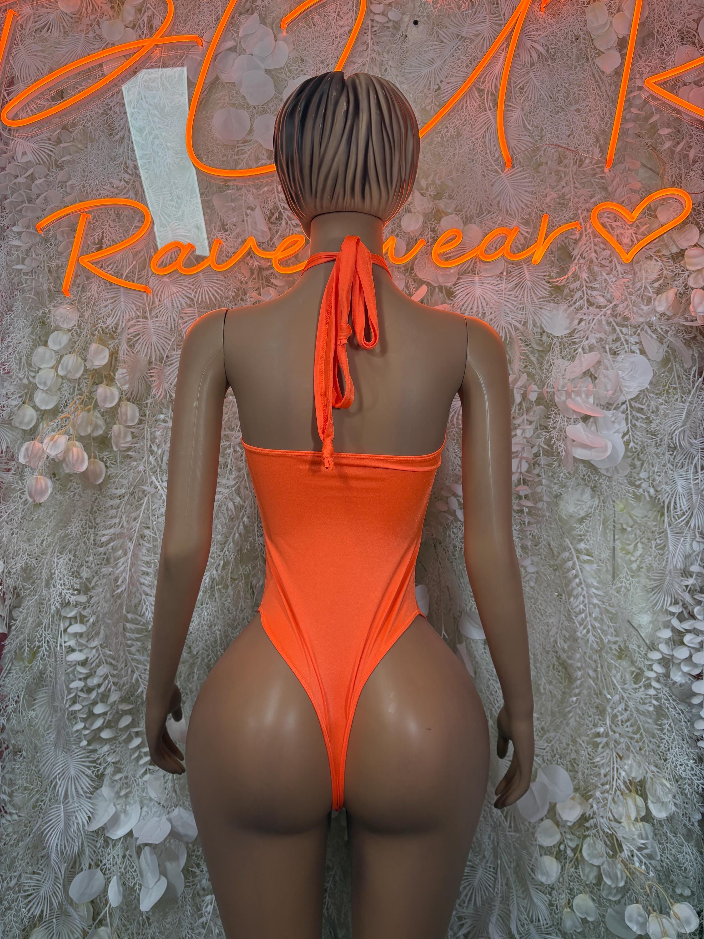 Orange backless bodysuit with tie-neck strap and open back, high-cut leg