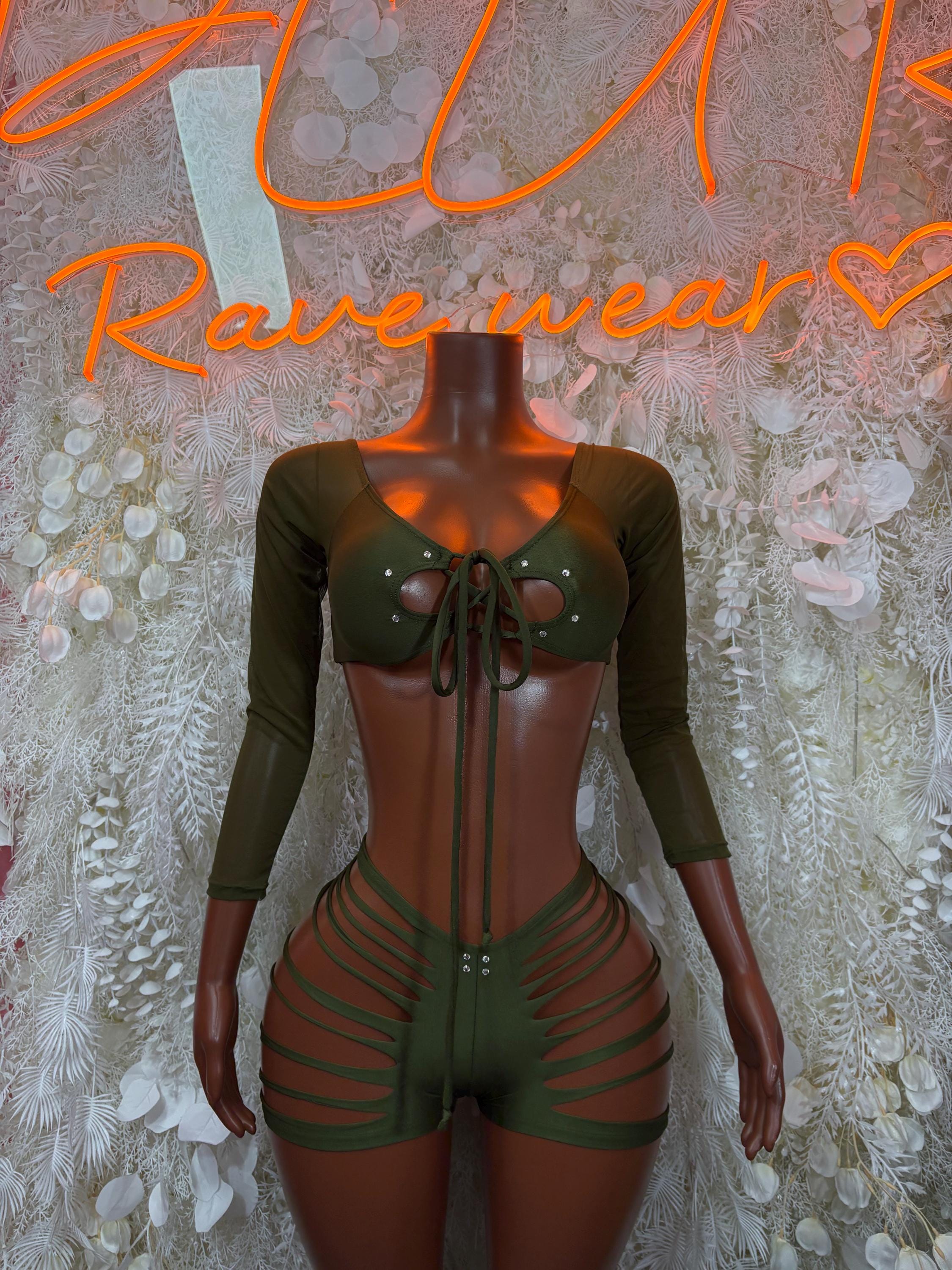 Green rave two-piece: lace-up cutout crop top, long sleeves, strappy shorts