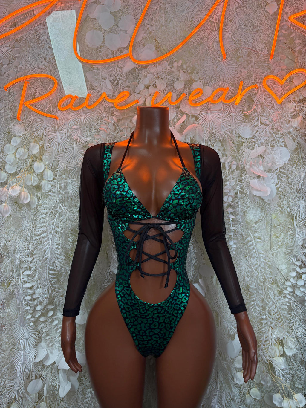 Green cheetah bodysuit with black mesh sleeves and lace-up front