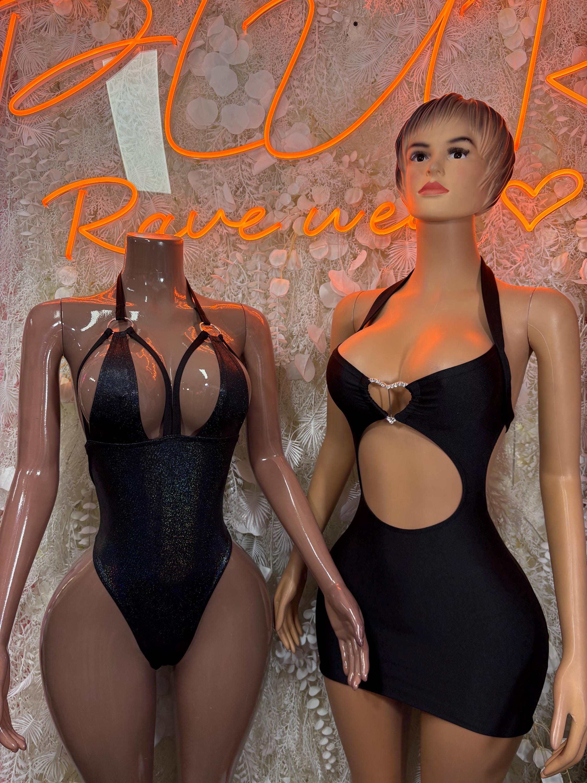 Black cutout mini dress with halter neckline and heart-ring bust detail