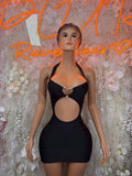Black cutout mini dress with bra-style straps and heart ring at bust