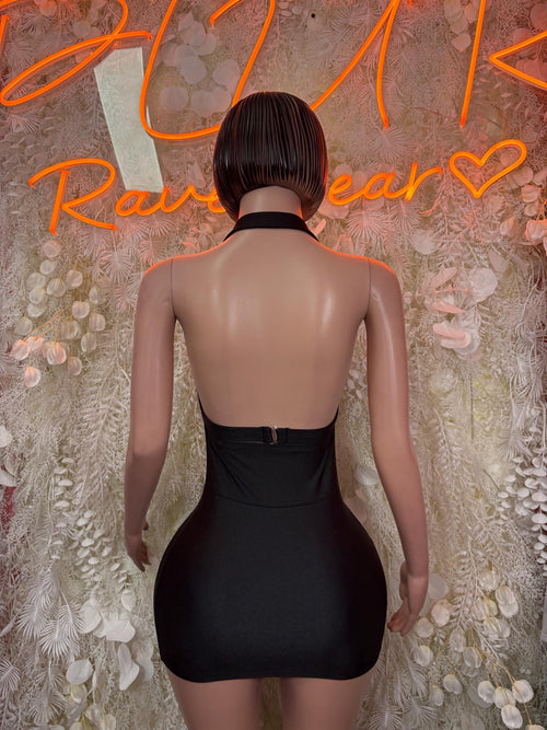 Black backless mini dress with tied shoulder straps and fitted sleeveless silhouette