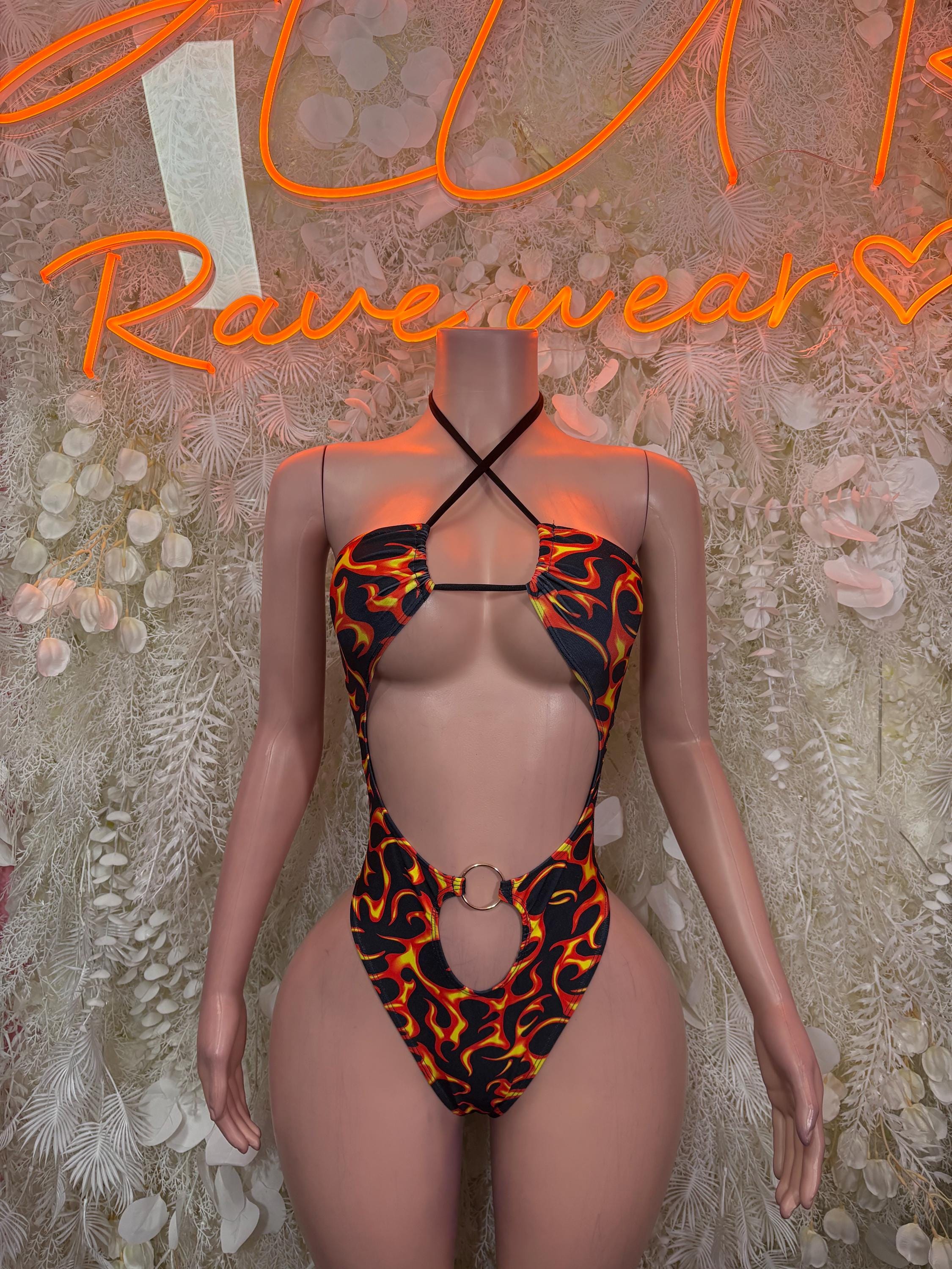 Flame-print rave bodysuit with black straps and halter crossback