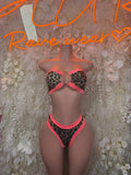 Coral leopard-print bodysuit with halter ring bra and high-cut thong bottoms