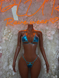 Blue metallic triangle bikini set with thin tie straps and matching high-cut bottoms