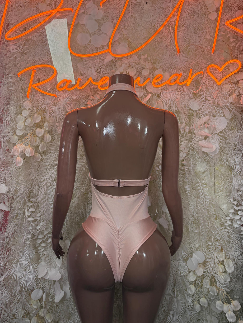 Nude bodysuit back with lace waistband and thin strap-like cutouts