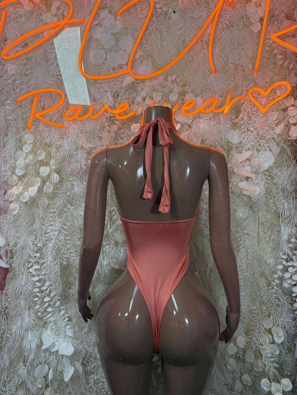 Brown halter bodysuit back view with ribbon tie and high-cut legs