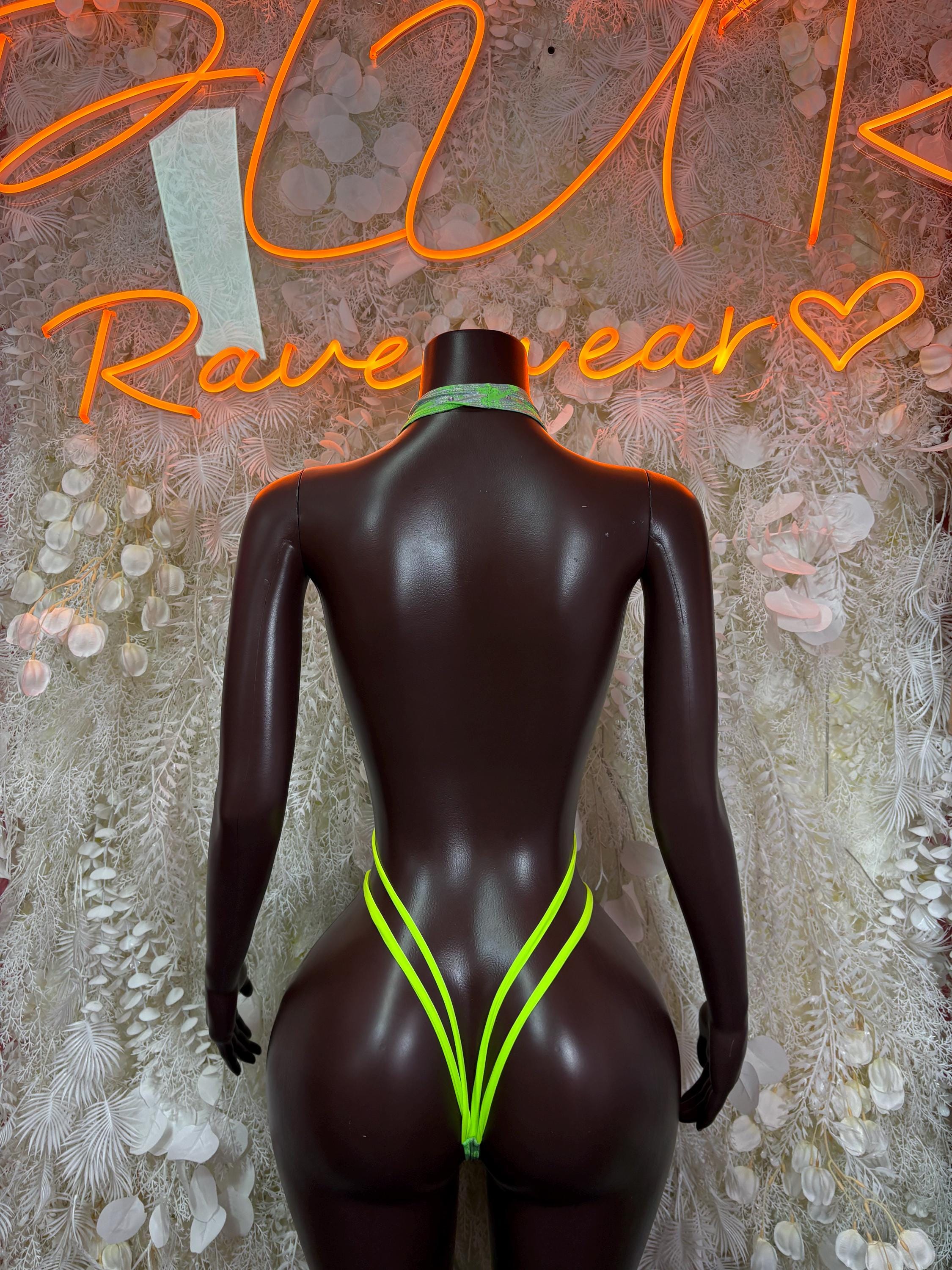 Backless green metallic rave bodysuit with neon green trim, back view
