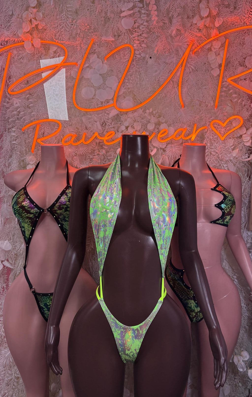 Snake-print slingshot swimsuit, green front panel and black side straps