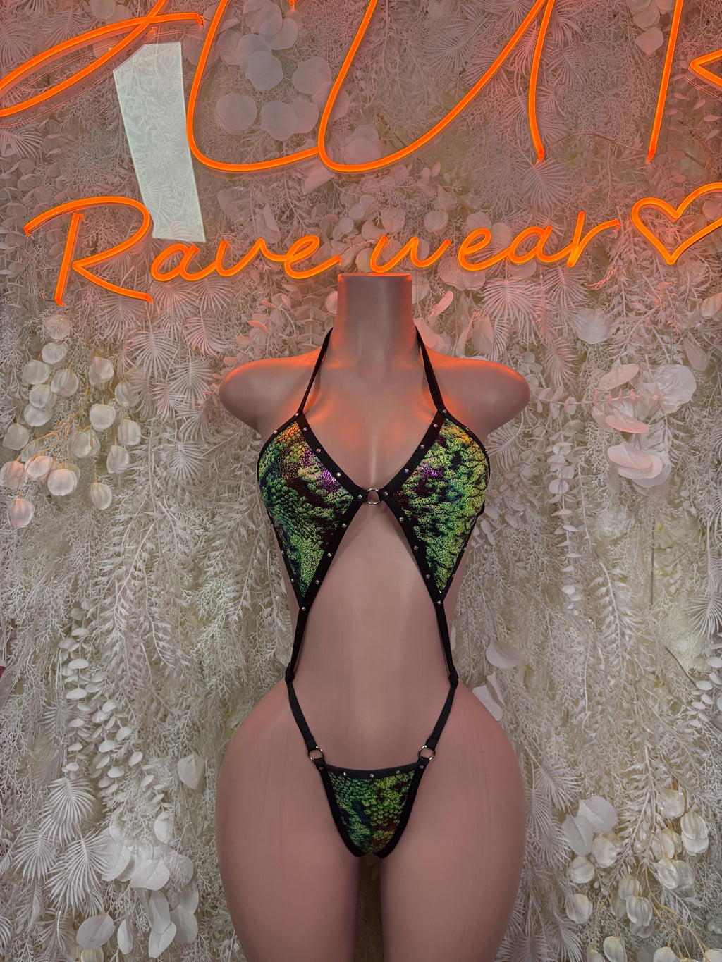 Snake-print slingshot swimsuit, green and black with triangle front and tie straps