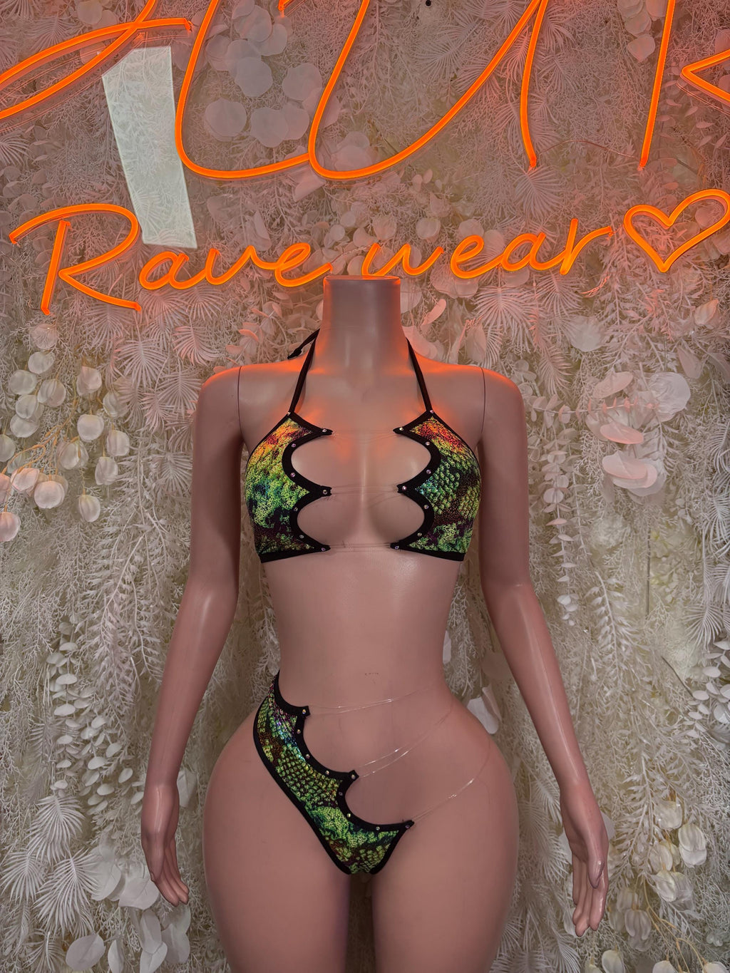 Two-piece bikini with green snake-print triangle top and matching thong with black trim
