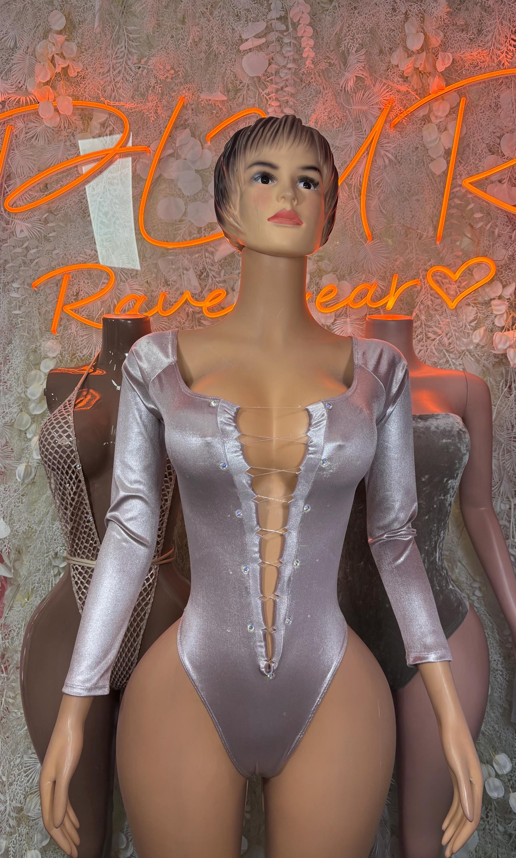 Gray metallic long-sleeve one-piece bodysuit with ruffle-trimmed V neckline and buttons