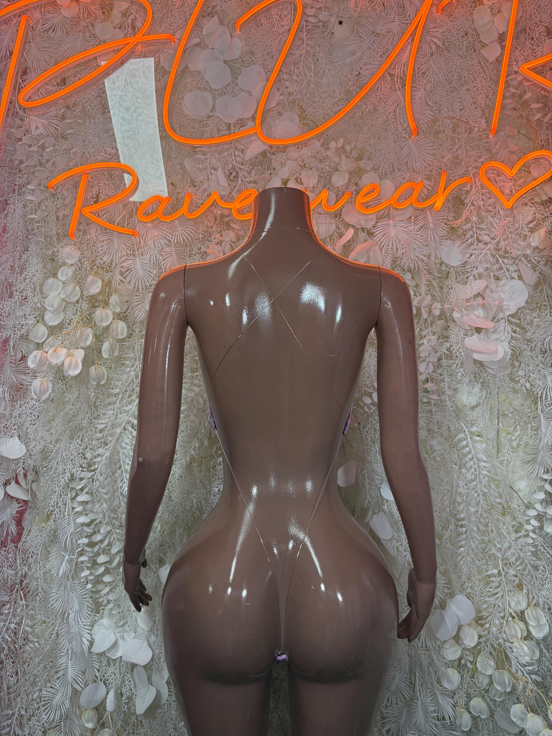 Purple mesh bodysuit shown from back, high-cut leg openings on mannequin