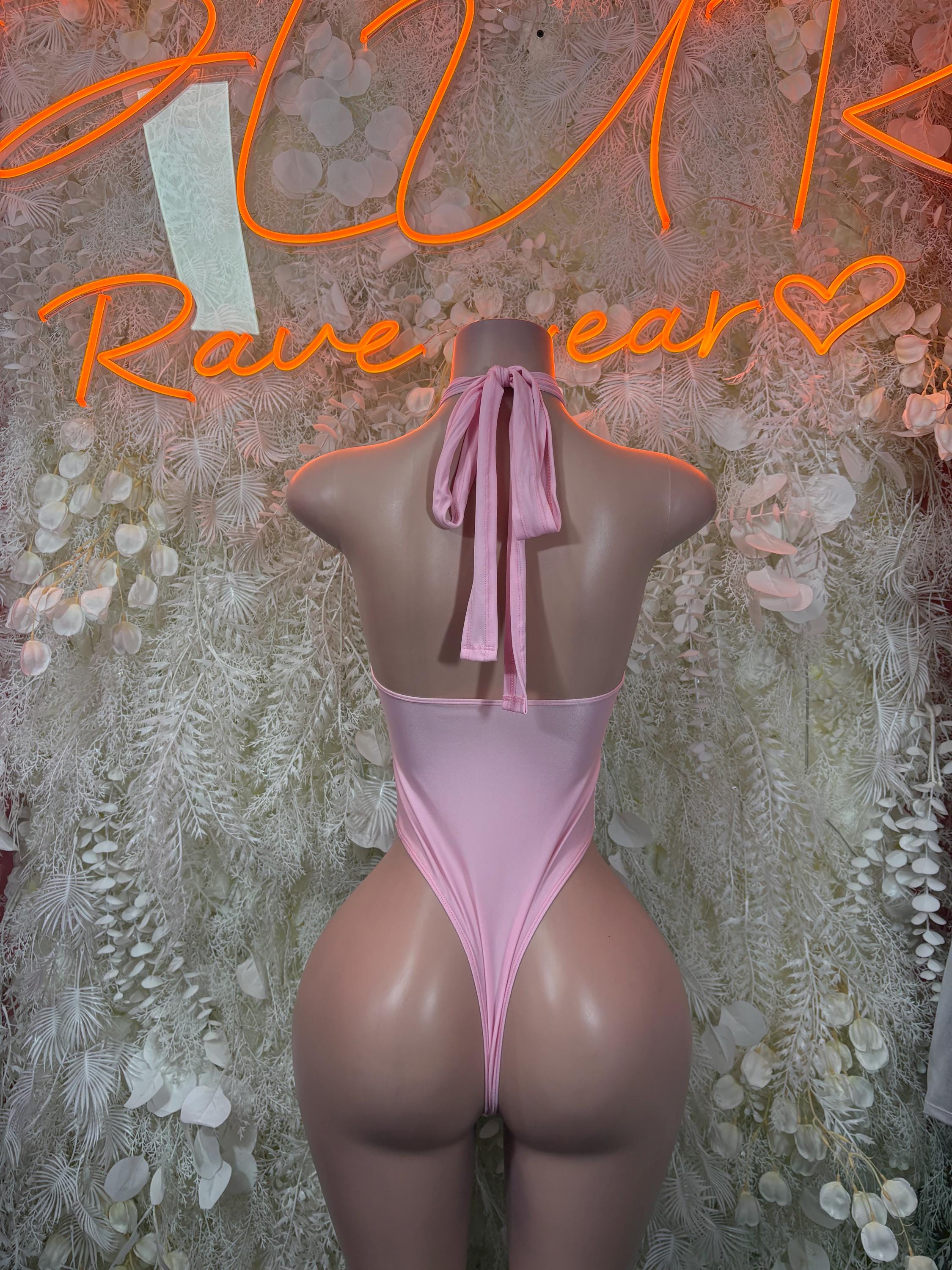Pink velvet bodysuit back view with halter tie ribbon and high-cut bottom