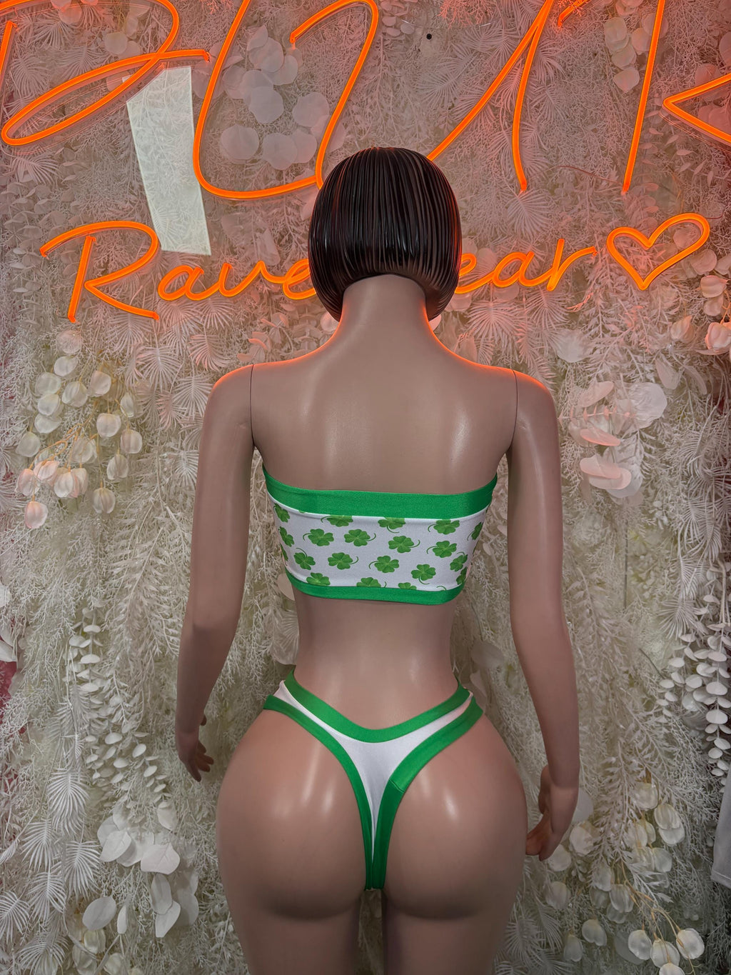 Green and white shamrock print bandeau top and high-waist bottoms, back view