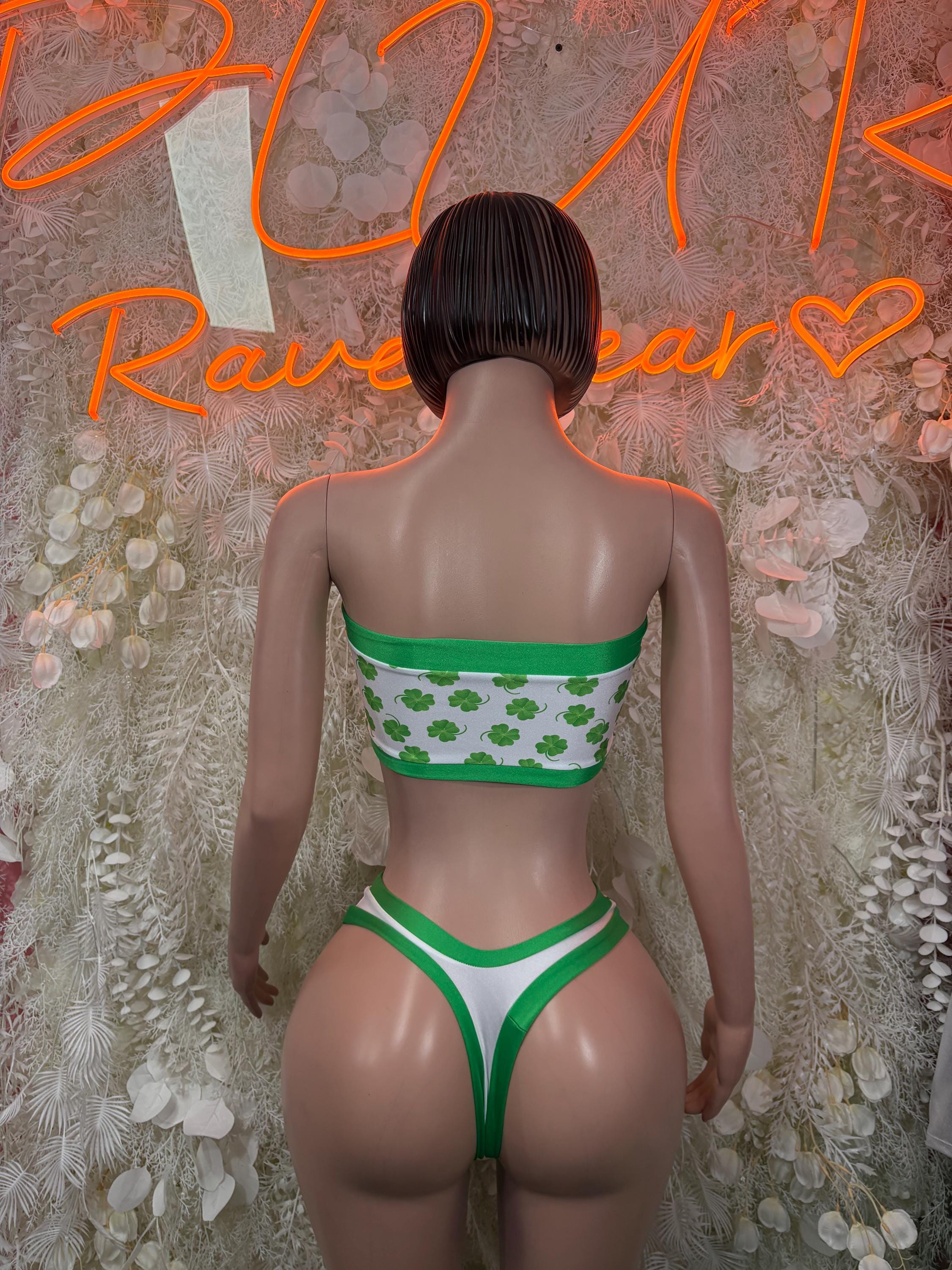 Green and white shamrock print bandeau top and high-waist bottoms, back view