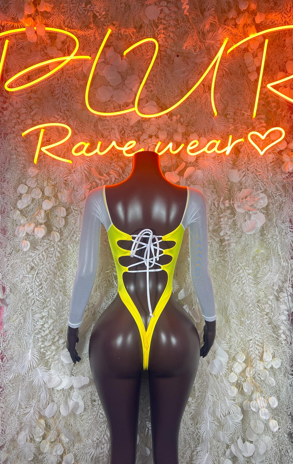 Neon yellow V-neck one-piece bodysuit with black corset lacing detail and long sleeves