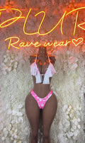 Pink ruffle skirt set with heart-print thong bottoms and white side ties