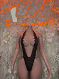 Black rhinestone fishnet bodysuit with chain straps and deep V neckline