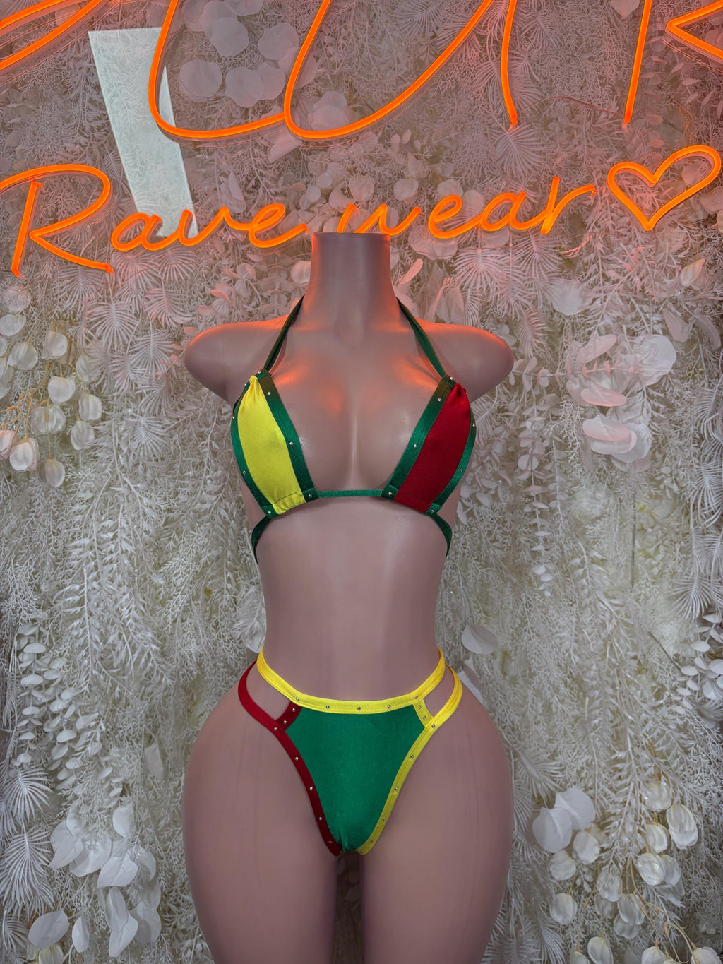 Rave flag bikini swimsuit set, green triangle top with yellow red accents, front view