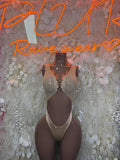 Tan lace bodysuit with deep V neckline and central chest cutout