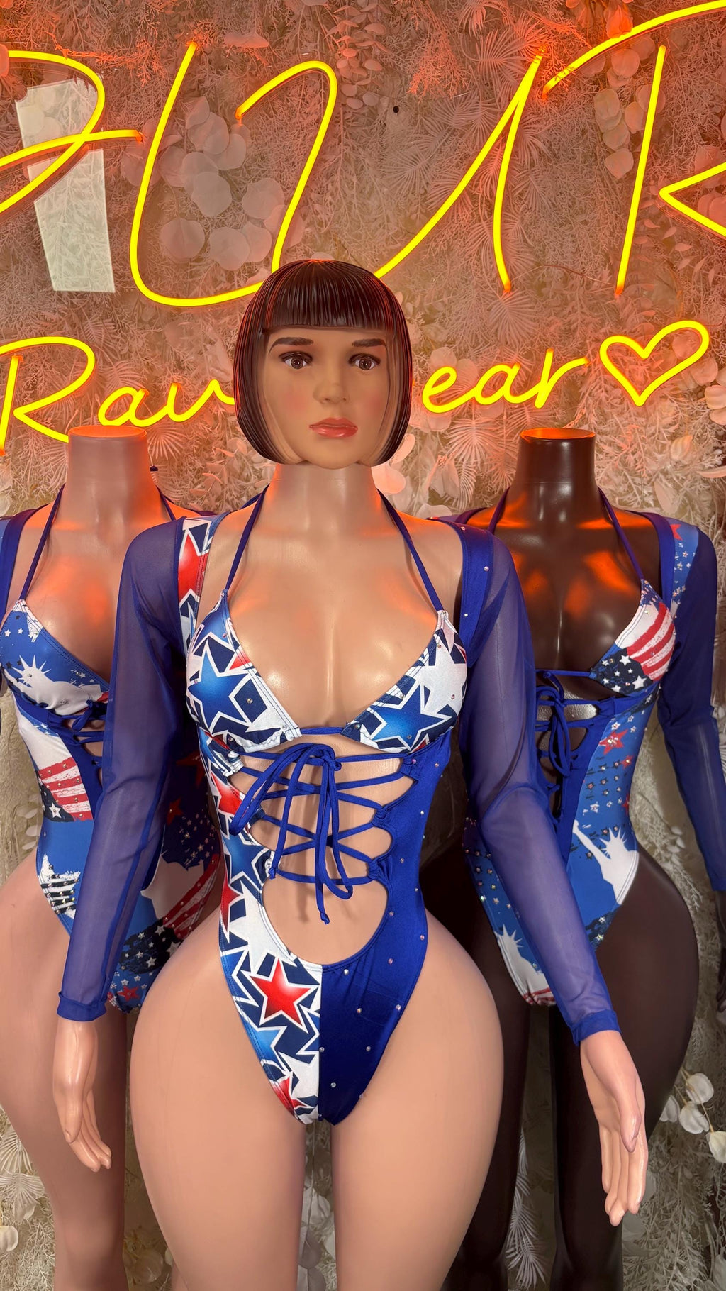 Patriotic blue bodysuit with long sleeves, front lace-up, star-and-stripe print
