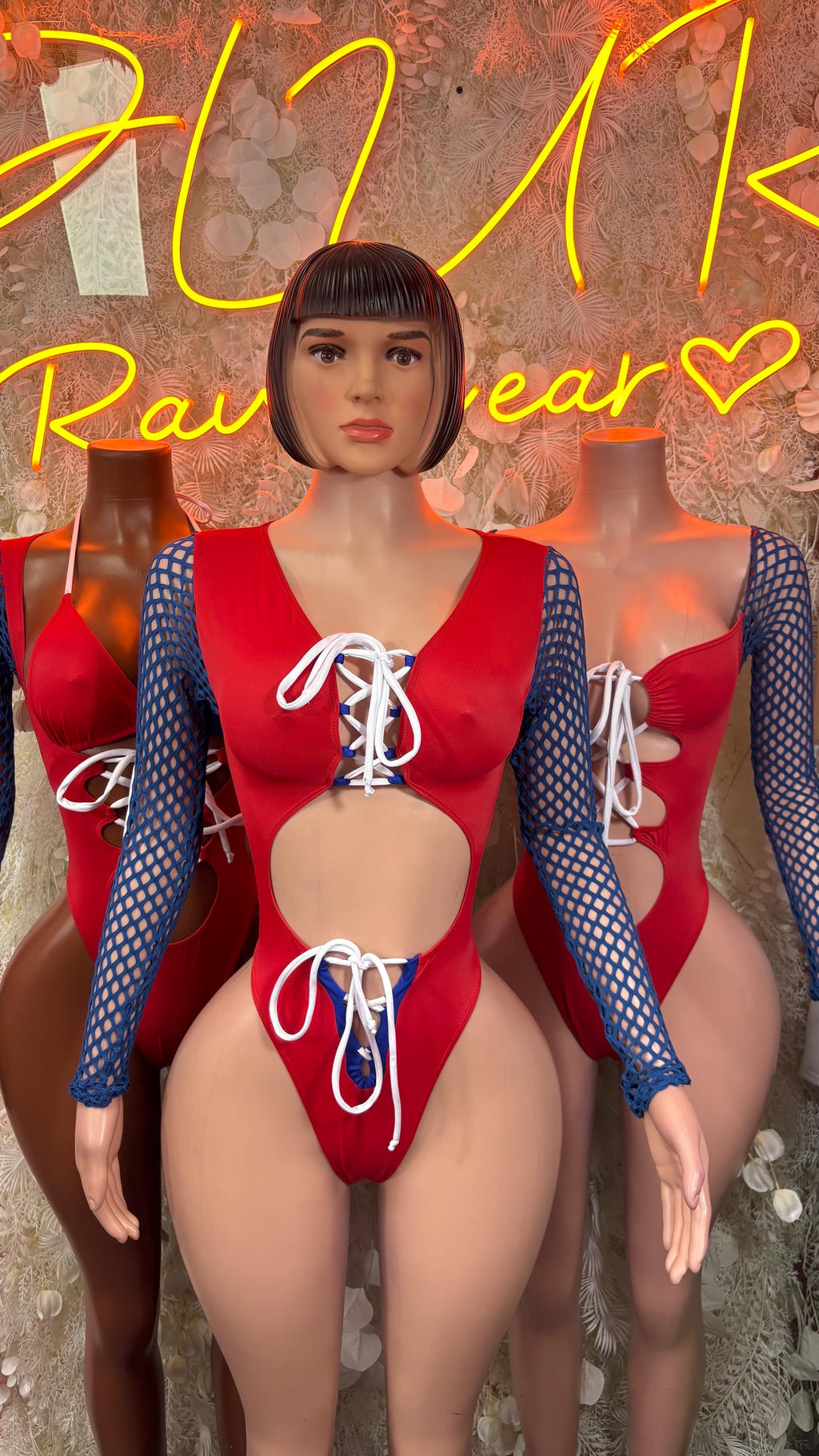 Red lace-up bodysuit with blue mesh long sleeves and front tie detail
