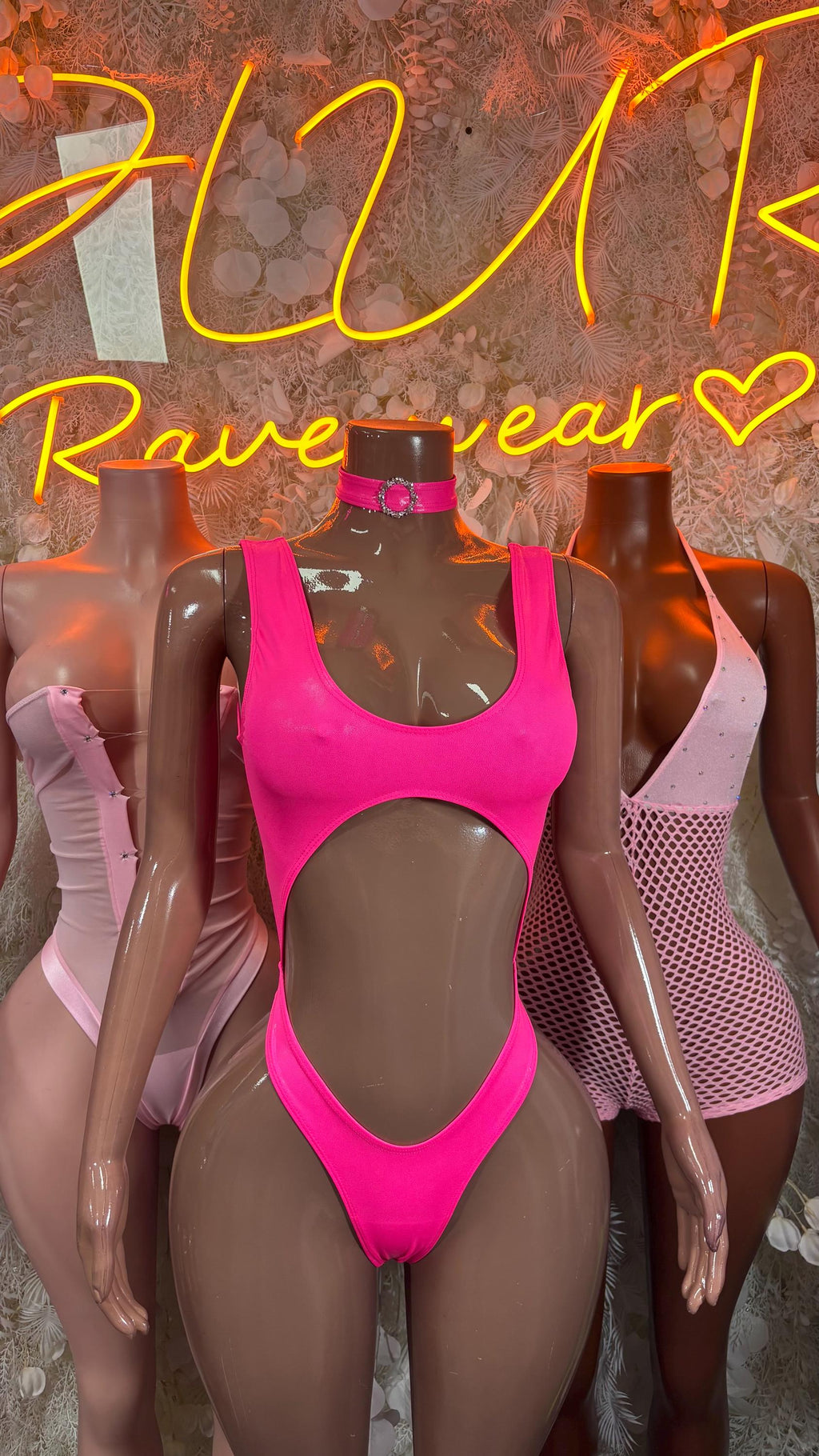 Hot pink one-piece bodysuit with scoop neck and cutout waist
